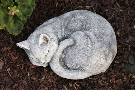 cat sleeping statue